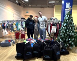 Dan and Hak's presenting charity donations to KIDECO Lakeside